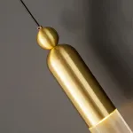 Настенный бра-светильник с прозрачным цилиндрическим корпусом и шарообразным клипом из латуни GELIS WALL Brass от ImperiumLoft