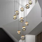 Серия подвесных светильников с LED-источниками света в полусферических рассеивателях с эффектом льда внутри шарообразных плафонов из тонированного стекла MAYER ORB L9 от ImperiumLoft