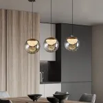 Серия подвесных светильников с LED-источниками света в полусферических рассеивателях с эффектом льда внутри шарообразных плафонов из тонированного стекла MAYER ORB L9 от ImperiumLoft