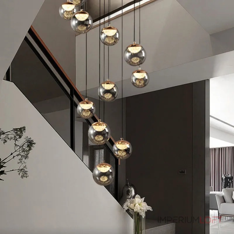 Серия подвесных светильников с LED-источниками света в полусферических рассеивателях с эффектом льда внутри шарообразных плафонов из тонированного стекла MAYER ORB L9 от ImperiumLoft