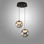 Серия подвесных светильников с LED-источниками света в полусферических рассеивателях с эффектом льда внутри шарообразных плафонов из тонированного стекла MAYER ORB L2 от ImperiumLoft