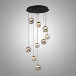 Серия подвесных светильников с LED-источниками света в полусферических рассеивателях с эффектом льда внутри шарообразных плафонов из тонированного стекла MAYER ORB L9 от ImperiumLoft