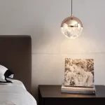Серия подвесных светильников с LED-источниками света в полусферических рассеивателях с эффектом льда внутри шарообразных плафонов EMMERT Gold от ImperiumLoft