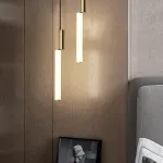 Серия подвесных светильников в виде светодиодных стержней на цилиндрическом основании из латуни TOSSENE H60 от ImperiumLoft