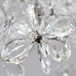 Серия инсталляций из подвесных хрустальных цветов, подсвеченных светодиодными источниками, расположенными на прямоугольном креплении CHARA L120 от ImperiumLoft