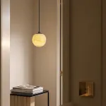 Серия подвесных светильников с шарообразным плафоном из натурального мрамора с фактурой Bulgary Stone и Молочного Нефрита BONN NEPHRITE Milk jade с лифтом от ImperiumLoft