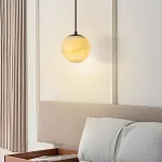 Серия подвесных светильников с шарообразным плафоном из натурального мрамора с фактурой Bulgary Stone и Молочного Нефрита BONN NEPHRITE Milk jade с лифтом от ImperiumLoft