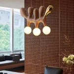 Серия оригинальных светильников из высококачественной древесины различных оттенков и латуни с тремя шарообразными плафонами REUBEN Light Brown от ImperiumLoft