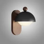Серия компактных настенных светильников с плафоном купольной формы на овальном деревянном креплении LIVNY A Black от ImperiumLoft