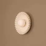 Серия настенных светильников с вогнутым рельефным корпусом из керамики и шарообразным плафоном в центре STEVEN Black от ImperiumLoft