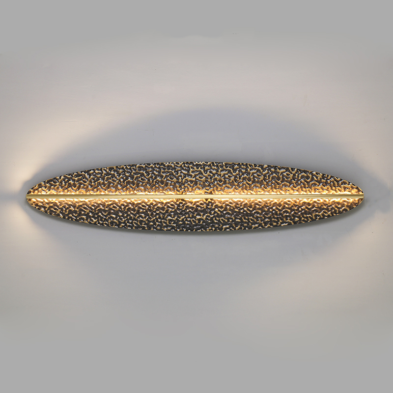 Серия светодиодных настенных светильников с латунным корпусом овальной формы и рельефной поверхностью с чернением MILIUS OVAL L120 от ImperiumLoft Серия светодиодных настенных светильников с латунным корпусом овальной формы и рельефной поверхностью с чернением MILIUS OVAL L120 от ImperiumLoft