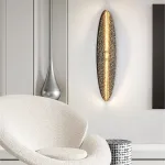 Серия светодиодных настенных светильников с латунным корпусом овальной формы и рельефной поверхностью с чернением MILIUS OVAL L100 от ImperiumLoft