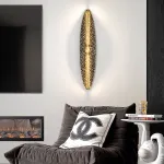 Серия светодиодных настенных светильников с латунным корпусом овальной формы и рельефной поверхностью с чернением MILIUS OVAL L100 от ImperiumLoft