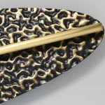 Серия светодиодных настенных светильников с латунным корпусом овальной формы и рельефной поверхностью с чернением MILIUS OVAL L100 от ImperiumLoft