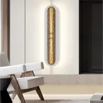 Серия светодиодных настенных светильников с удлиненным латунным корпусом и рельефной поверхностью с чернением MILIUS L60 от ImperiumLoft