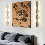 Серия светодиодных настенных светильников с латунным корпусом волнистой формы и рельефной поверхностью с чернением MILIUS WAVY L120 от ImperiumLoft