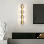 Серия светодиодных настенных светильников с латунным корпусом волнистой формы и рельефной поверхностью с чернением MILIUS WAVY L120 от ImperiumLoft