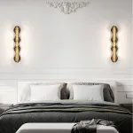 Серия светодиодных настенных светильников с латунным корпусом волнистой формы и рельефной поверхностью с чернением MILIUS WAVY L120 от ImperiumLoft