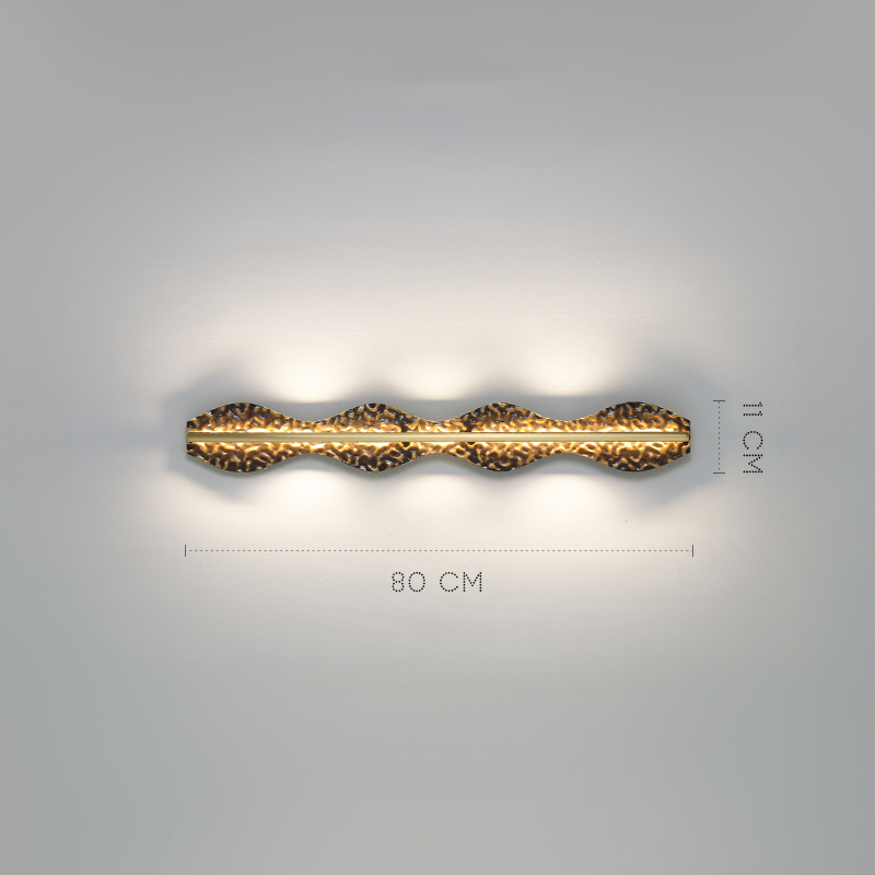 Серия светодиодных настенных светильников с латунным корпусом волнистой формы и рельефной поверхностью с чернением MILIUS WAVY L80 от ImperiumLoft