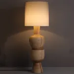 Дизайнерский торшер с массивным фигурным корпусом из цельного дерева и текстильным цилиндрическим плафоном HELGOT от ImperiumLoft