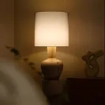 Дизайнерский торшер с массивным фигурным корпусом из цельного дерева и текстильным цилиндрическим плафоном HELGOT от ImperiumLoft