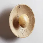 Настенный светодиодный светильник в виде вогнутого диска из натурального травертина от ImperiumLoft