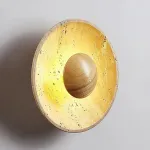 Настенный светодиодный светильник в виде вогнутого диска из натурального травертина от ImperiumLoft