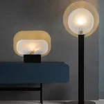 Серия настольных ламп в виде металлической перфорированной пластины и рассеивателя из натурального камня CONRAD B TAB A