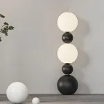 Напольный светильник из чередующихся черных и светящихся шаров разного размера STELLAN B