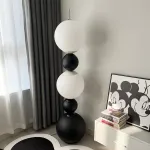 Напольный светильник из чередующихся черных и светящихся шаров разного размера STELLAN B