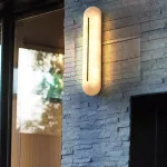 Настенный светильник с удлиненным рассеивателем из натурального испанского мрамора и центральным латунным клипом ALTON WALL Pitch от ImperiumLoft