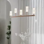 Серия рядных светильников с плафонами вогнутой цилиндрической формы на разноуровневых вертикальных стойках GISSEL A от ImperiumLoft