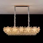 Реечный светильник с подвесками из ограненного хрусталя и рельефных стеклянных цветков EGEL PAW LONG