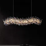 Реечный светильник с подвесками из ограненного хрусталя и рельефных стеклянных цветков EGEL LONG