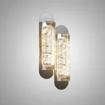 Серия настенных светильников с закругленным корпусом удлиненной формы и толстостенным рассеивателем из акрила с вертикальными гранями MEIR B ImperiumLoft