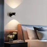 Серия настенных светильников с двунаправленным линзированным источником света на поворотном корпусе конической формы LOGE Black ImperiumLoft