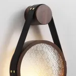 Серия настенных светильников с рельефным стеклянным плафоном в форме линзы на кожаном ремешке ODMAR Black ImperiumLoft