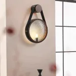 Серия настенных светильников с рельефным стеклянным плафоном в форме линзы на кожаном ремешке ODMAR Black ImperiumLoft