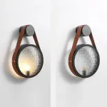 Серия настенных светильников с рельефным стеклянным плафоном в форме линзы на кожаном ремешке ODMAR Brown ImperiumLoft