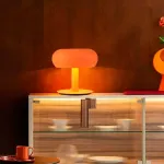 Серия настольных светодиодных ламп со стеклянным тороидальным плафоном на центральной стойке KIDDY Orange от ImperiumLoft