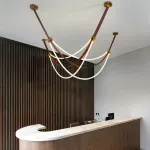 Светильник в виде кожаного ремня с закрепленными на нём двумя гибкими силиконовыми шнурами в текстильной оплетке с LED подсветкой OBERT B P2 3000 4000 6000K от ImperiumLoft