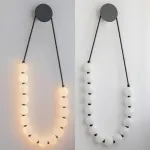 Серия настенных светодиодных светильников с белыми шарообразными плафонами на подвесном тросе Nano Orb Black от ImperiumLoft