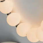 Серия настенных светодиодных светильников с белыми шарообразными плафонами на подвесном тросе Nano Orb Black от ImperiumLoft