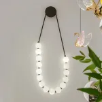 Серия настенных светодиодных светильников с белыми шарообразными плафонами на подвесном тросе Nano Orb Black от ImperiumLoft