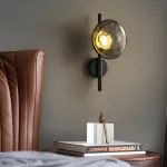 Серия настенных светодиодных светильников с шарообразными плафонами из выдувного стекла на вертикальных стойках с круглым креплением Whisper Wall Black от ImperiumLoft