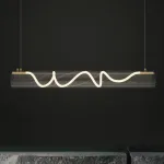 Серия реечных светильников с гибким световым шнуром в оплетке внутри прозрачного цилиндрического плафона GLORIFY OPTIC L150 от ImperiumLoft