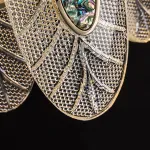 Серия люстр из хрустальных подвесок с разной фактурой в виде стилизованных листьев и вставками из перламутра на кольцевом каркасе RAIMON D60 от ImperiumLoft