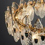 Серия люстр из хрустальных подвесок с разной фактурой в виде стилизованных листьев и вставками из перламутра на кольцевом каркасе RAIMON D60 от ImperiumLoft
