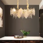 Серия люстр с многоярусным абажуром из подвесок в виде листьев из стекла и декором из хрустальных бусин разной формы VIRGILIO от ImperiumLoft