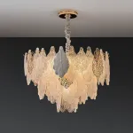 Серия люстр с многоярусным абажуром из подвесок в виде листьев из стекла, металла и керамики OLEANDER D65 от ImperiumLoft